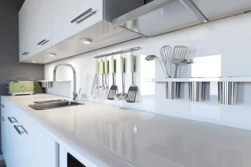 DALS Eco Puck LED lights installed under white kitchen cabinets illuminating countertops and backsplash