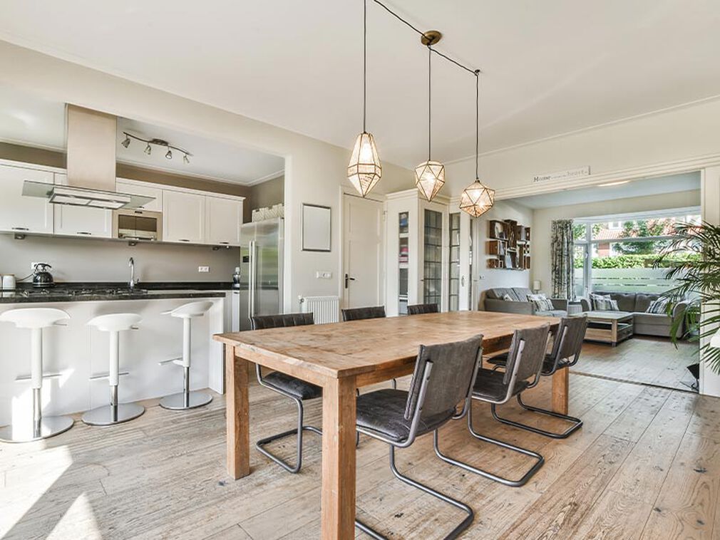 Three pendant chandelier from Z Lite in a modern, rustic kitchen